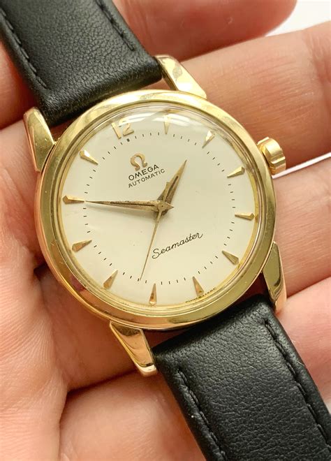 omega automatic seamaster gold watch.